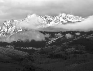 grayscale photograph of mountain alps with clouds thumbnail