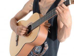 man playing a dreadnought acoustic guitar thumbnail