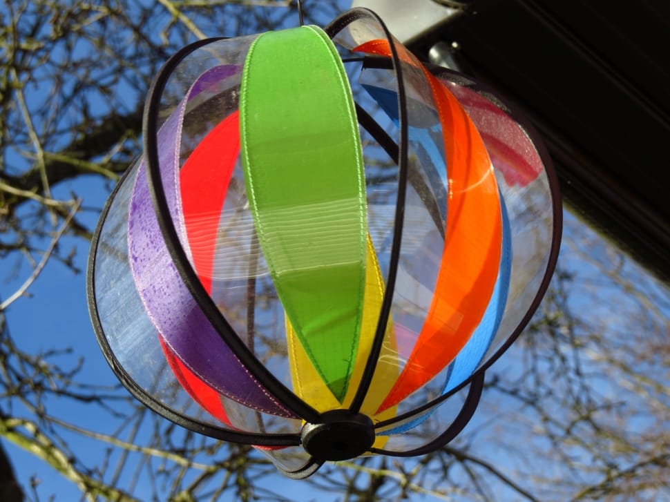 selective focus photography of green, purple, and orange lantern preview