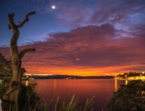 landscape photography of lake during sunset thumbnail