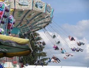 crowd of people riding on swing ride thumbnail