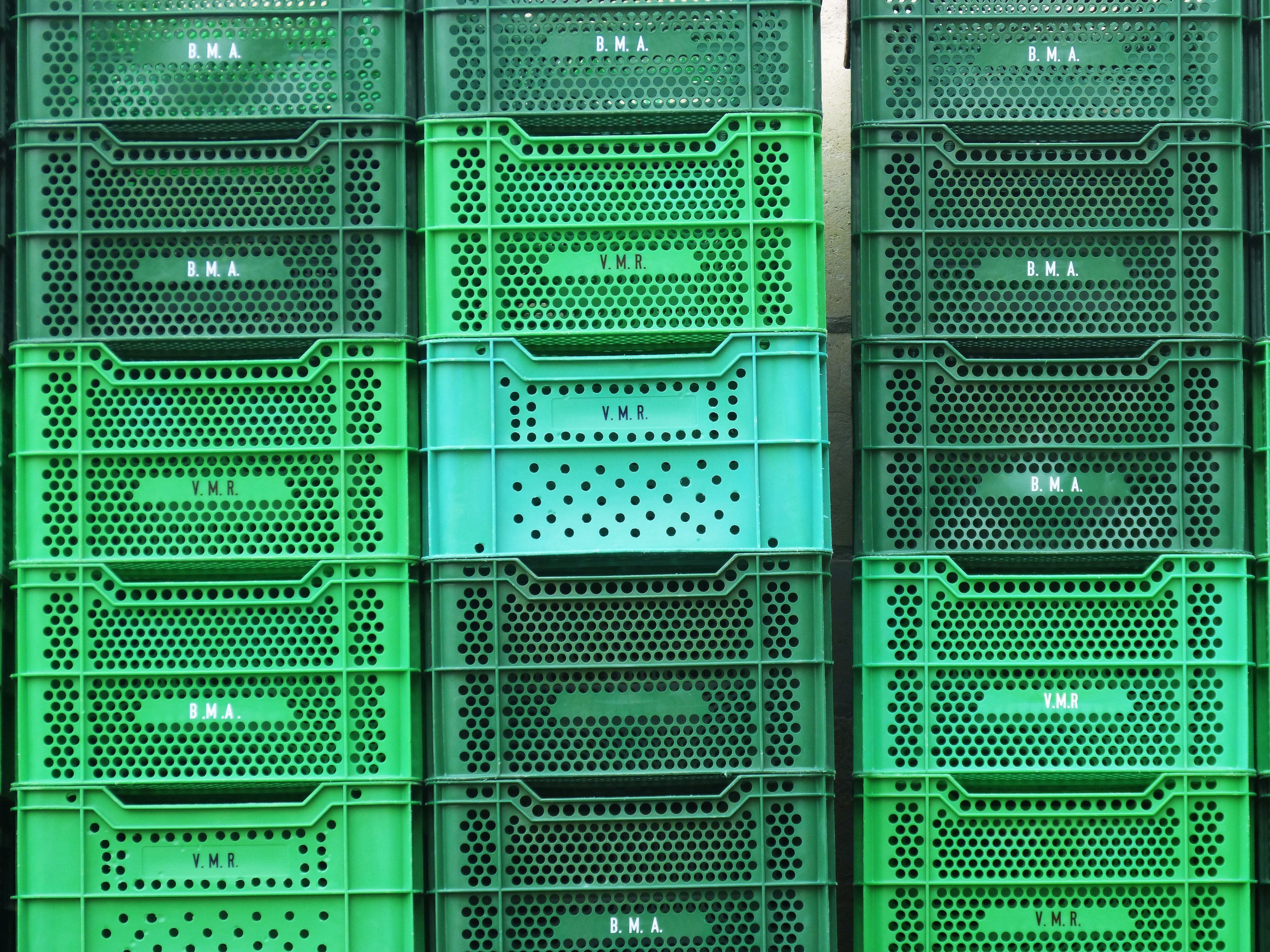pile of green plastic crates