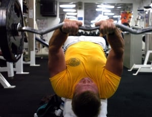 man in yellow lifting barbell thumbnail