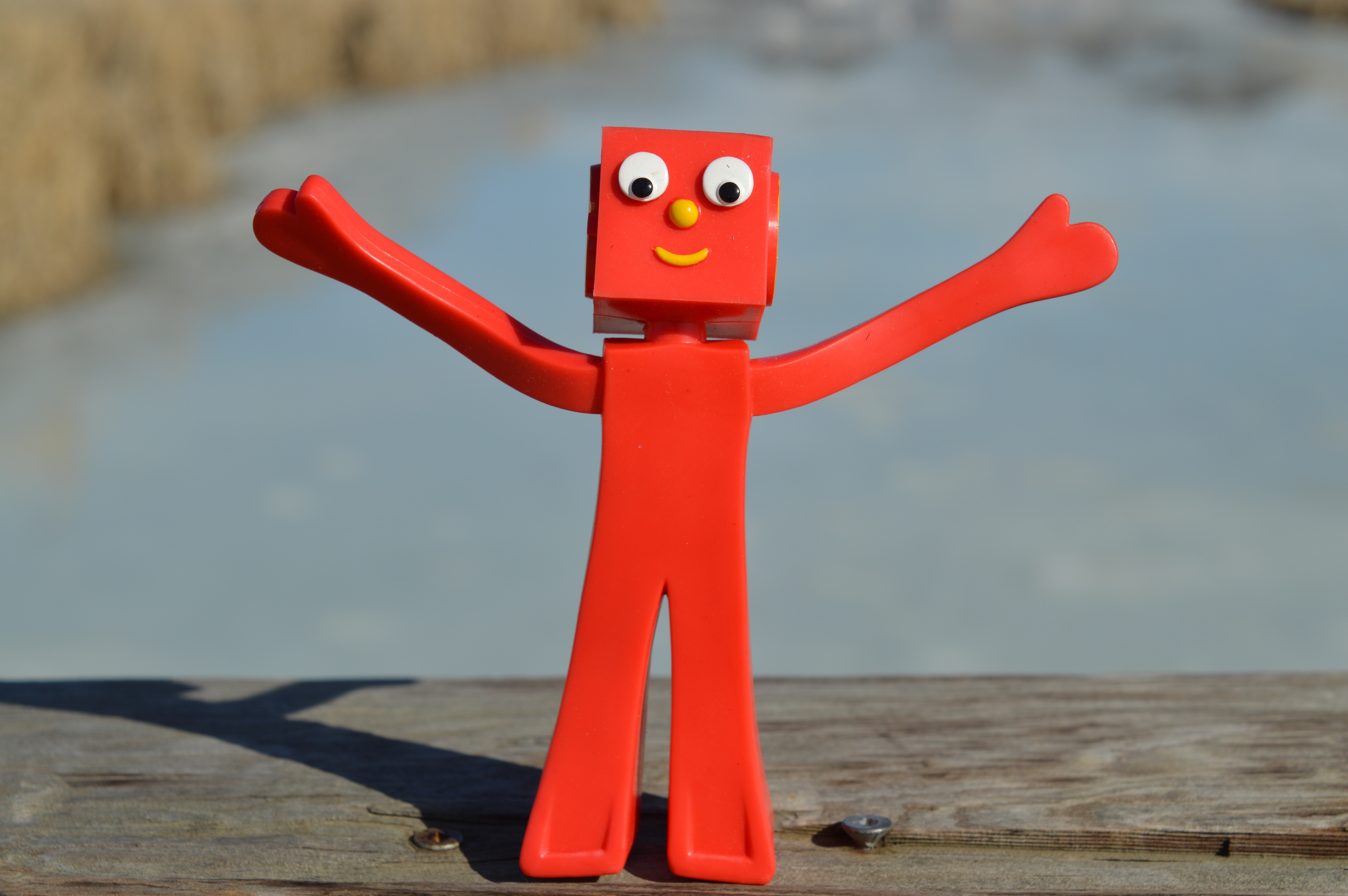 red plastic robot mini figure