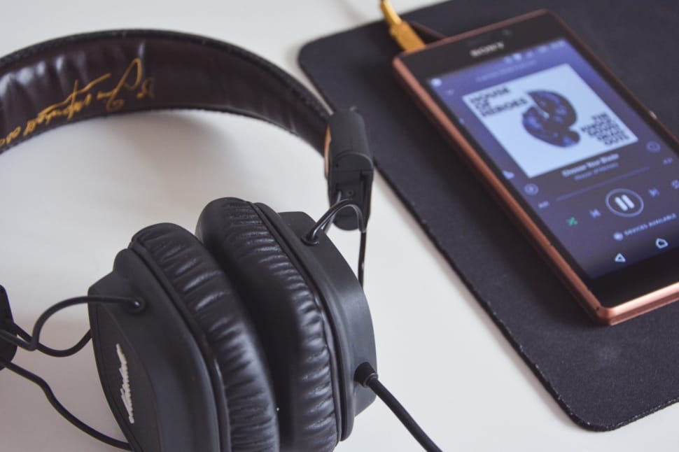 black corded headphones near black media player on preview