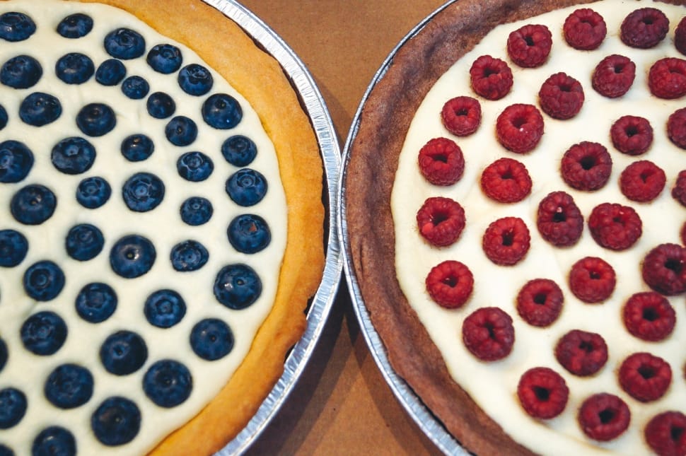 raspberry and blueberry pies in round trays preview