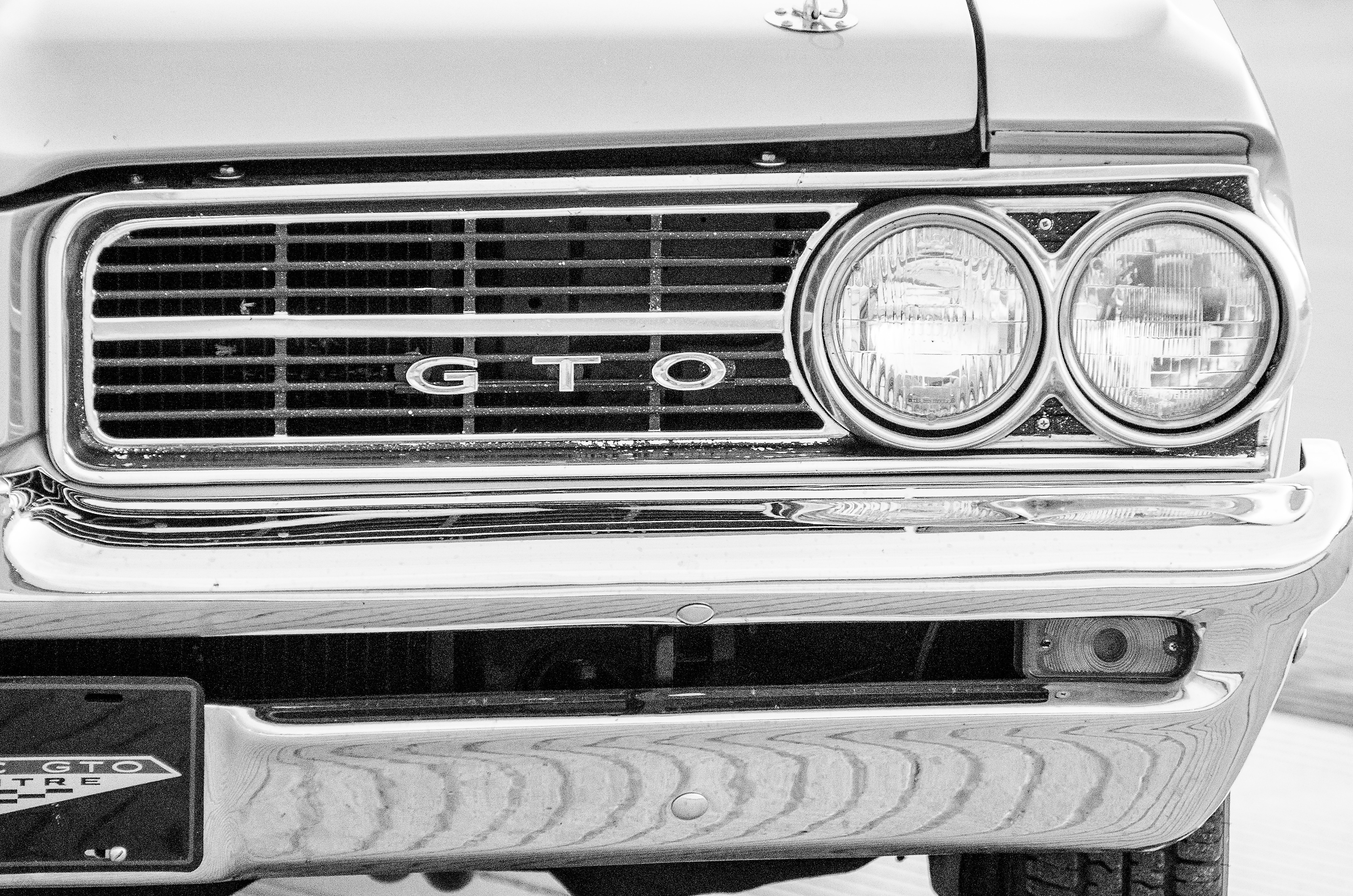 grayscale photo of GTO car
