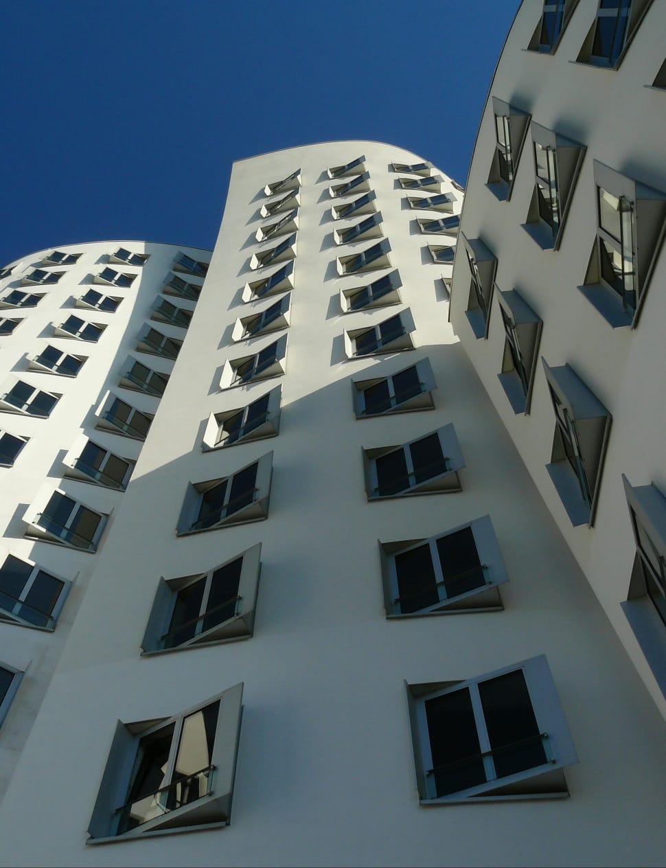worm's eyeview photograph of white concrete building preview