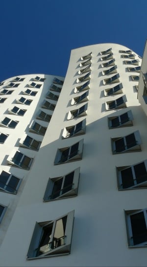 worm's eyeview photograph of white concrete building thumbnail