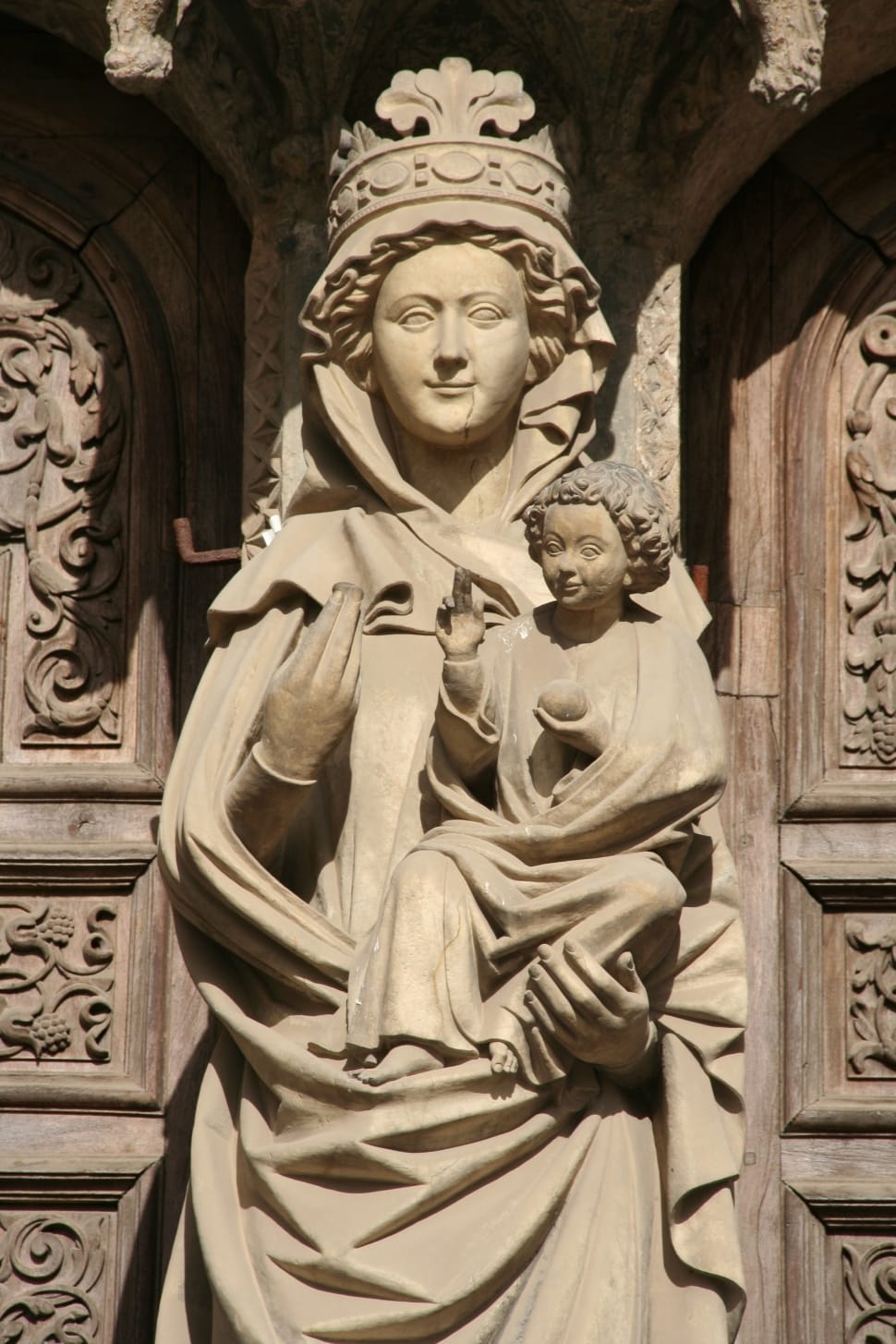 brown concrete mother and child religious figure statue preview