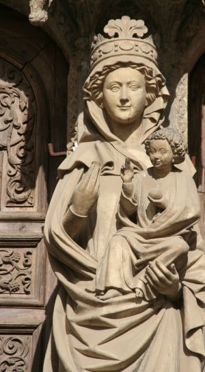 brown concrete mother and child religious figure statue thumbnail