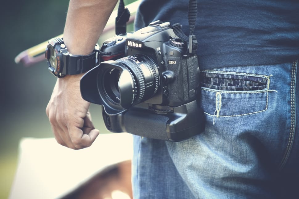 person wearing watch with nikon camera preview
