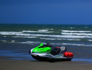 white and green personal watercraft thumbnail