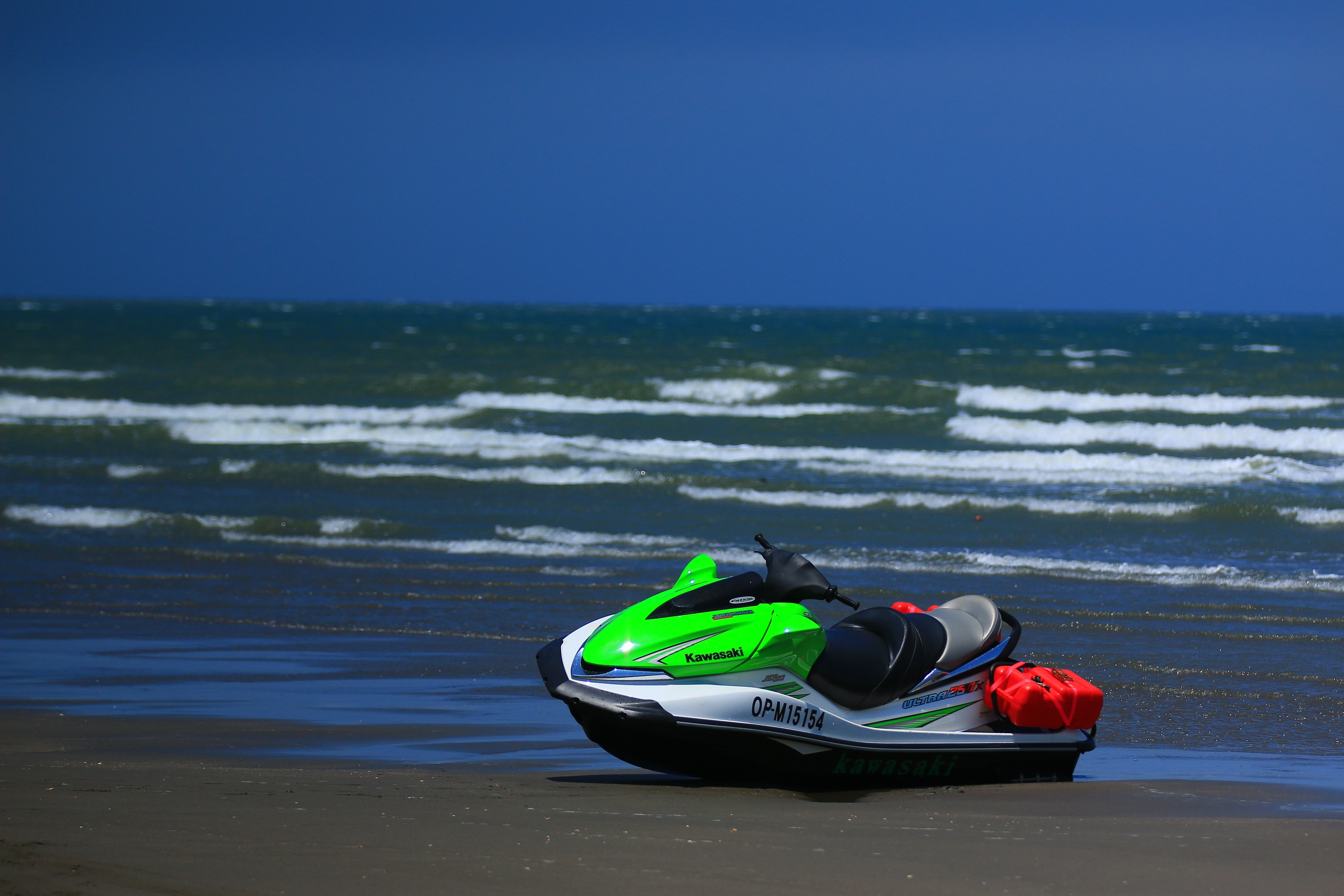 white and green personal watercraft