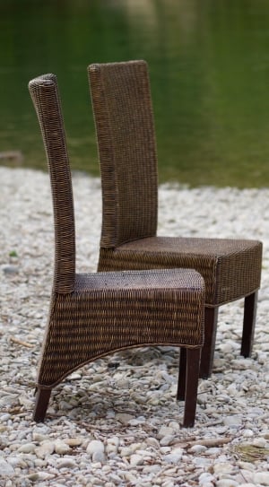 2 brown woven armless chairs thumbnail