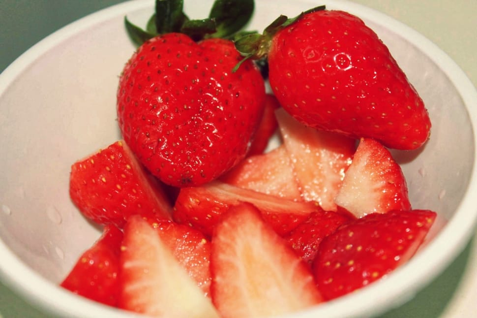 close up photo of strawberries in  white bowl preview