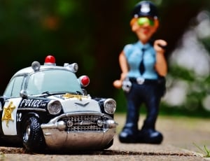 black and white die cast model police car thumbnail