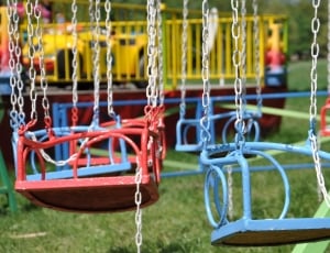 blue and red metal swings thumbnail