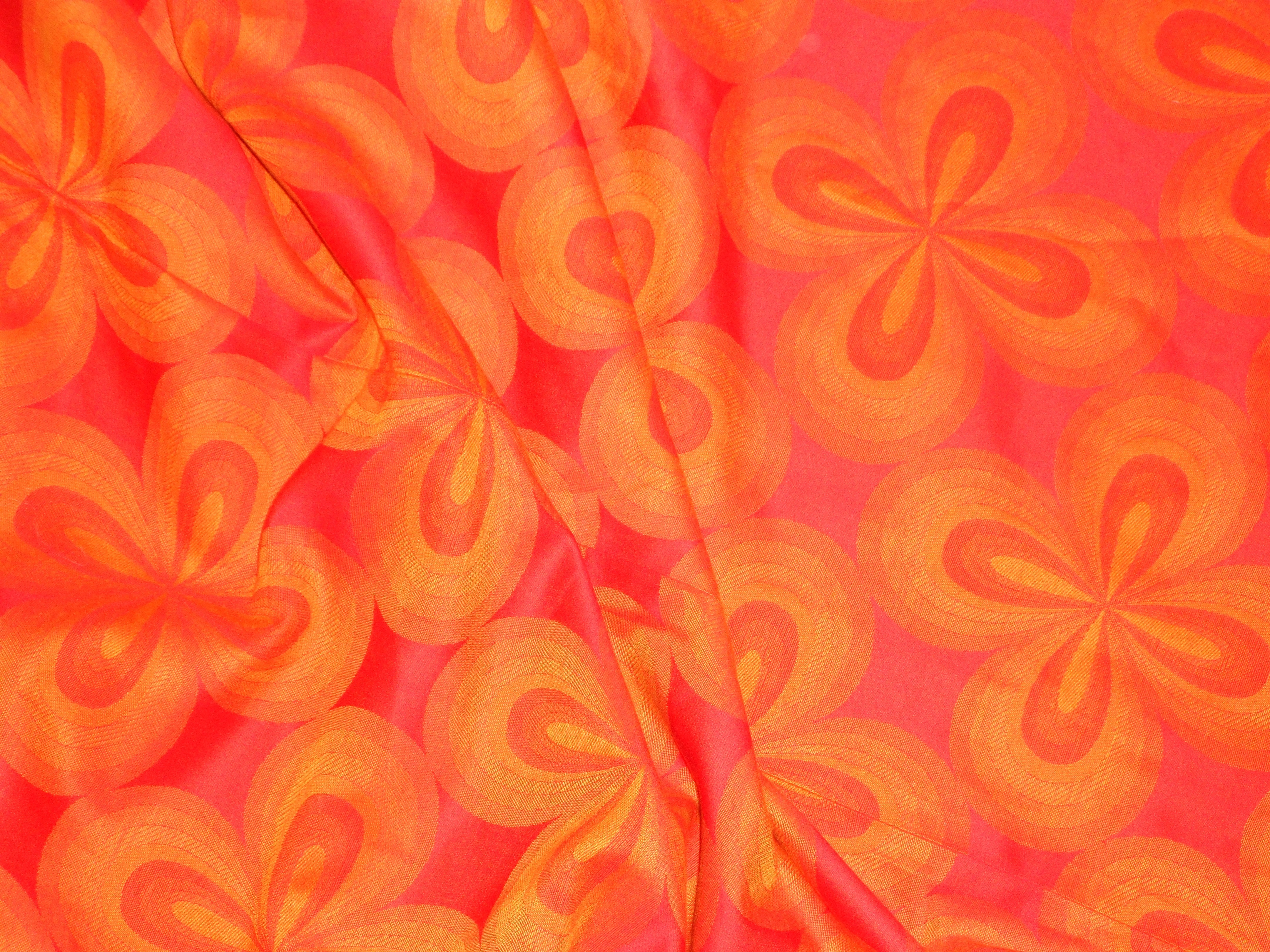 orange and pink floral textile