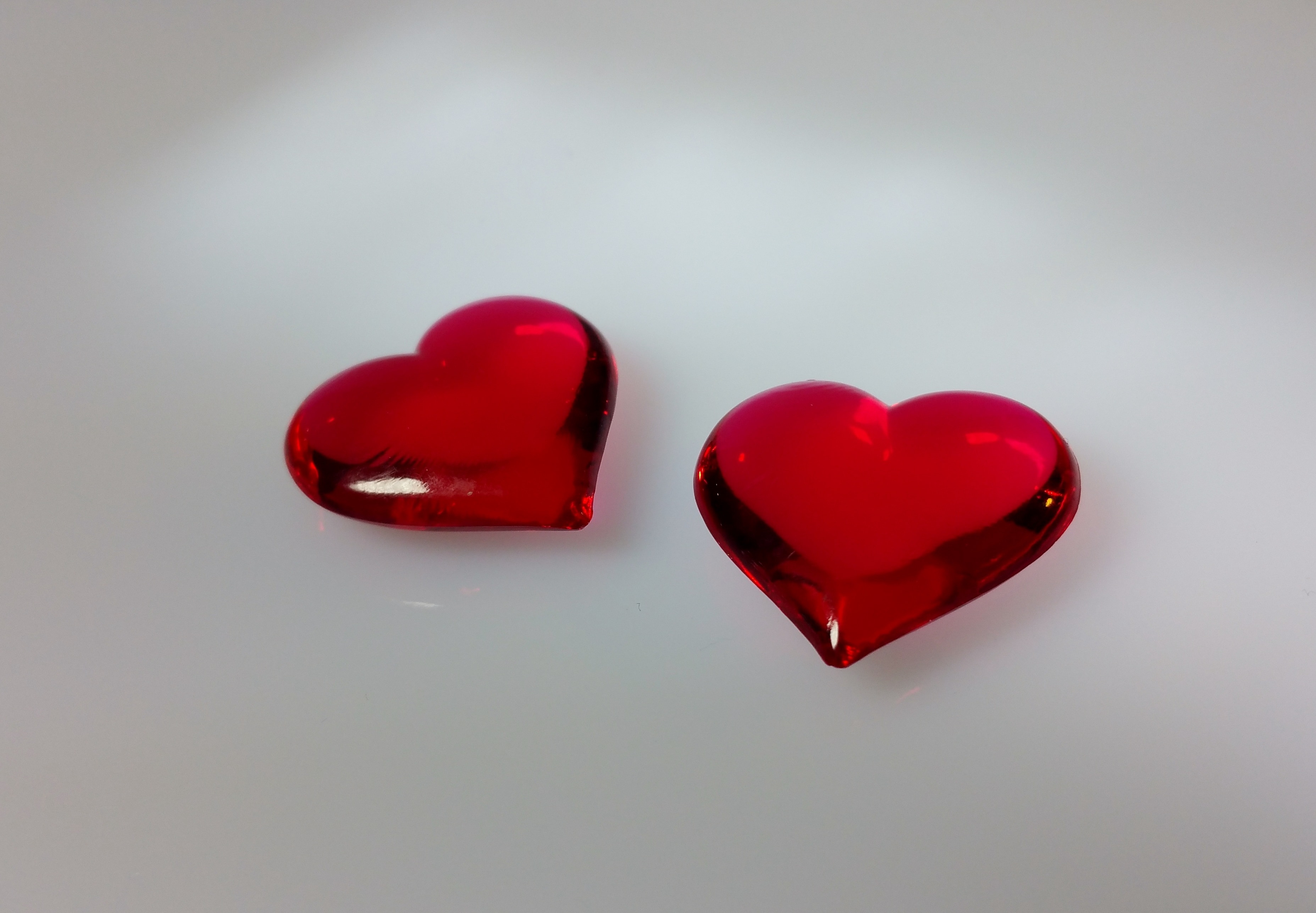 2 red heart shape ornaments