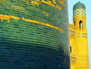 green and golden bricked mosque thumbnail