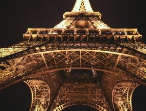eiffel tower during night time in low angle photography thumbnail