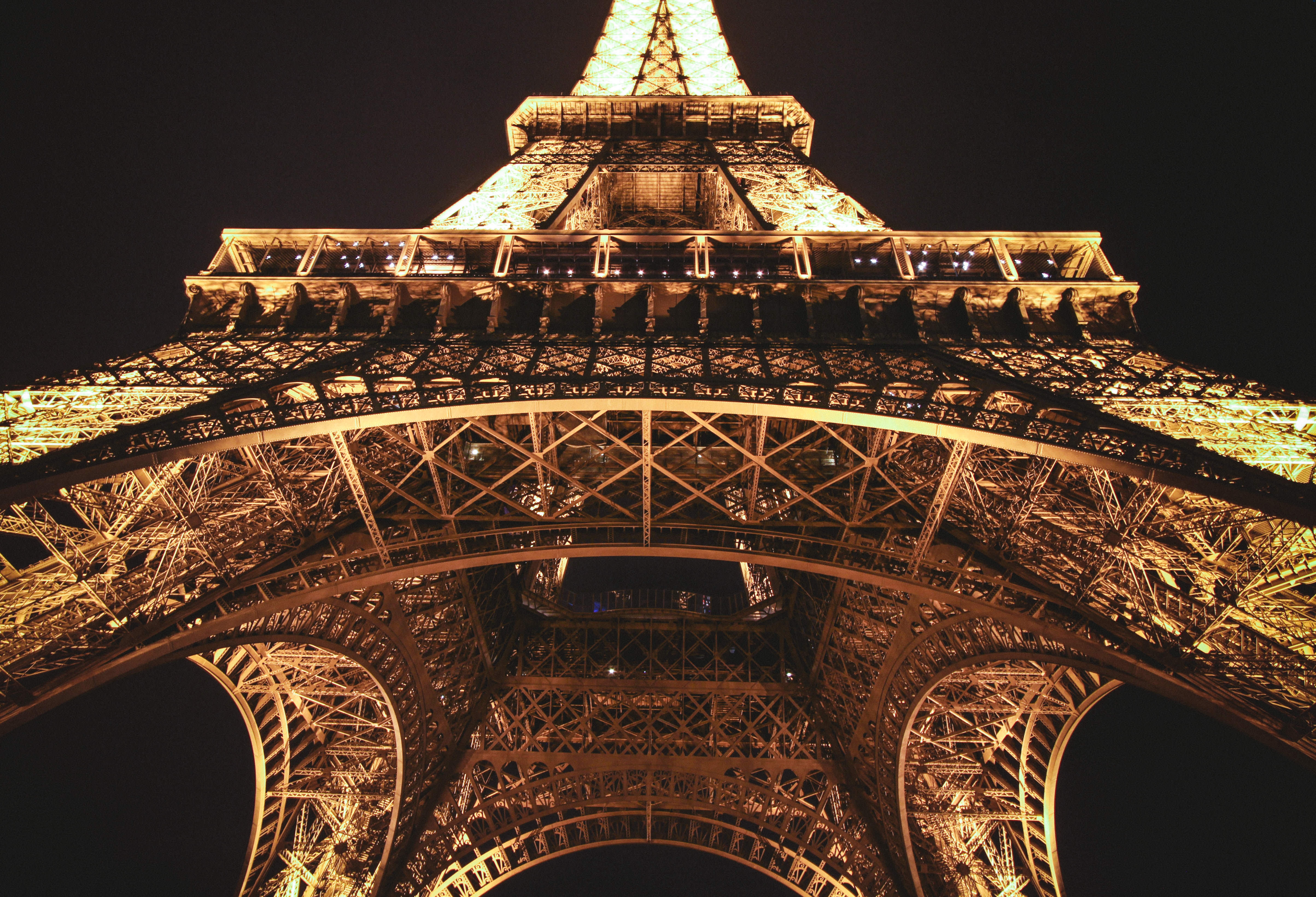 eiffel tower during night time in low angle photography