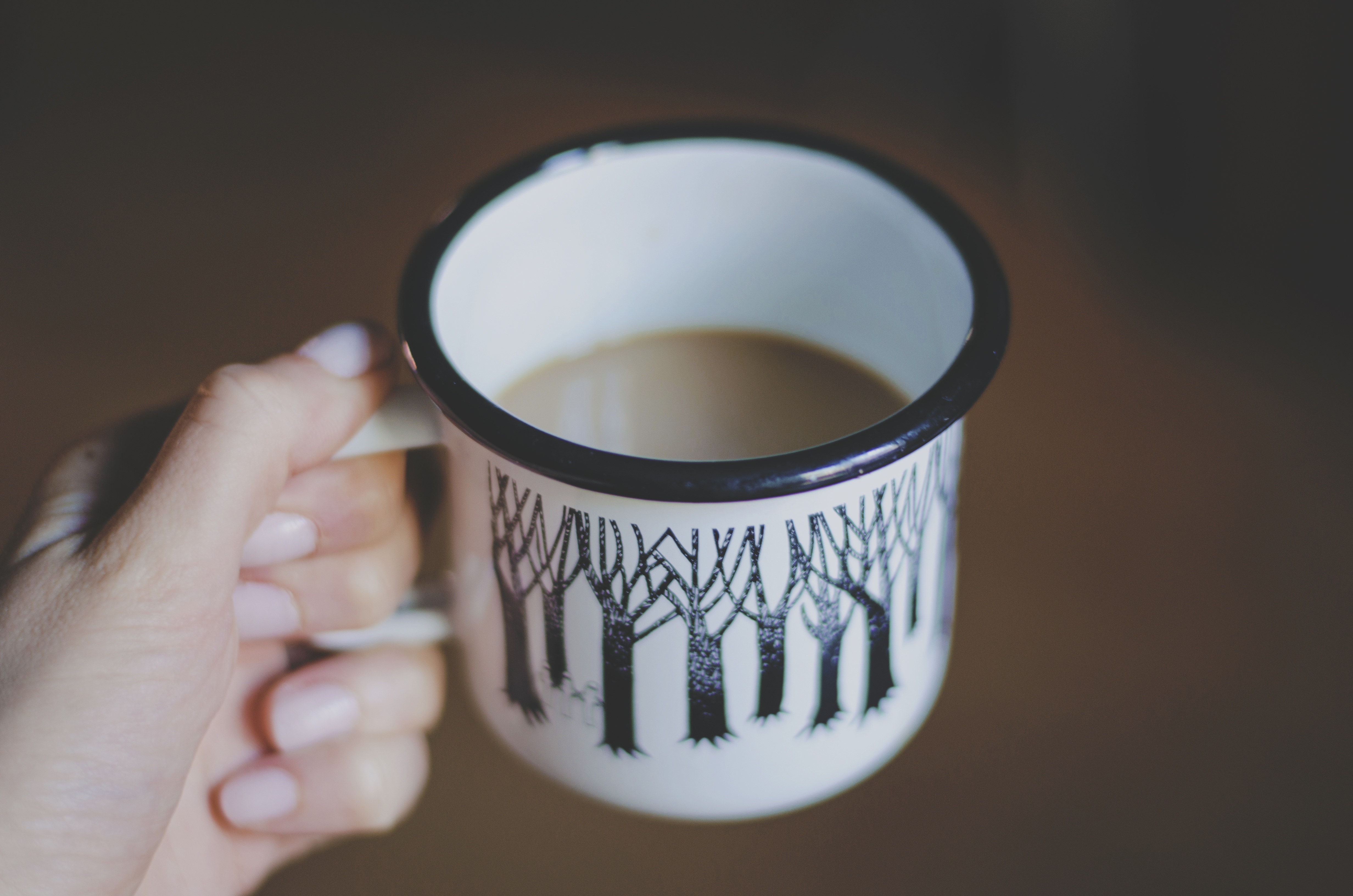 white and black tree printed cup