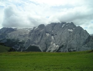 grey rock formation under white clouds during daytime thumbnail