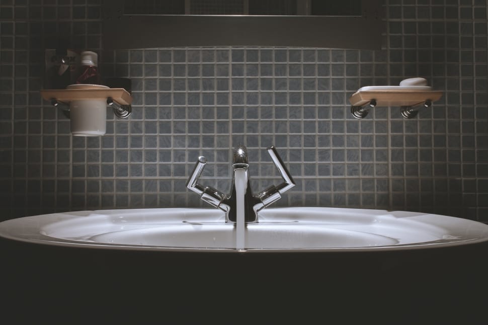 stainless steel faucet and white ceramic sink preview