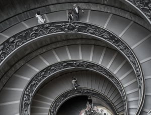 greyscale photography of spiral staircase thumbnail