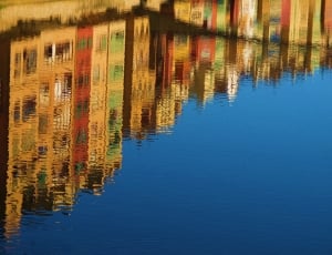 photography of reflectorize buildings on the wter thumbnail