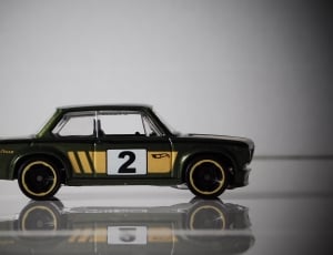 black yellow and white 2 toy sedan thumbnail