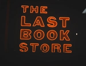 photo of red and orange the last book store led signage at black room thumbnail
