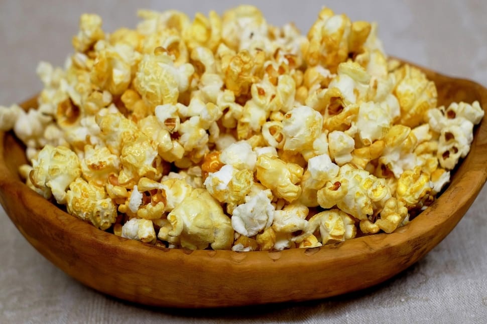 buttered popcorn with brown wooden bowl preview