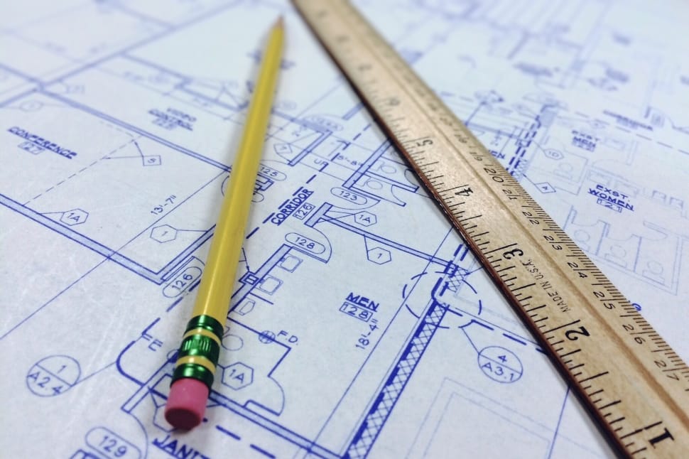 brown ruler and pencil at the top of floor plan paper preview