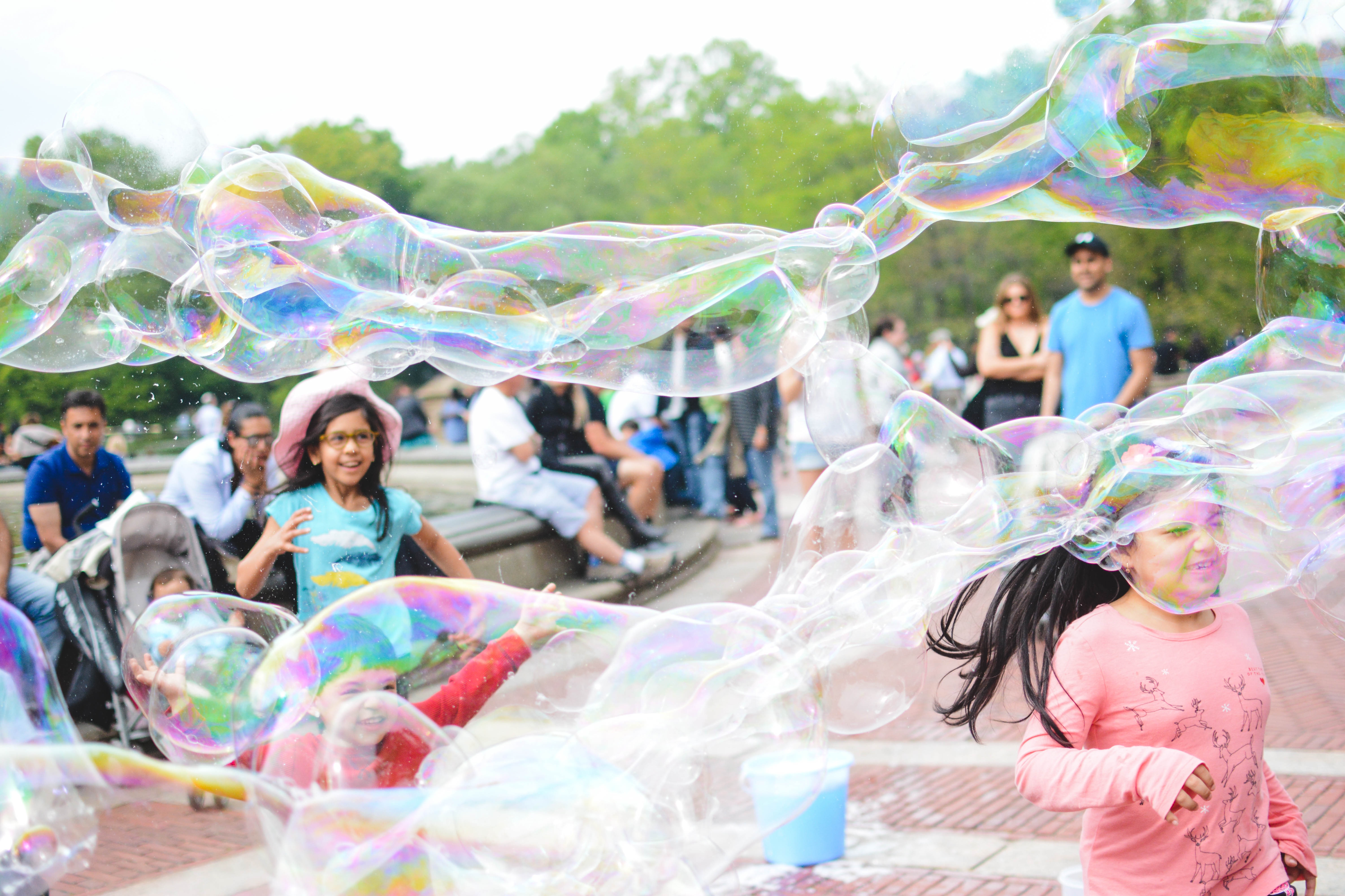 girl's playing bubbles