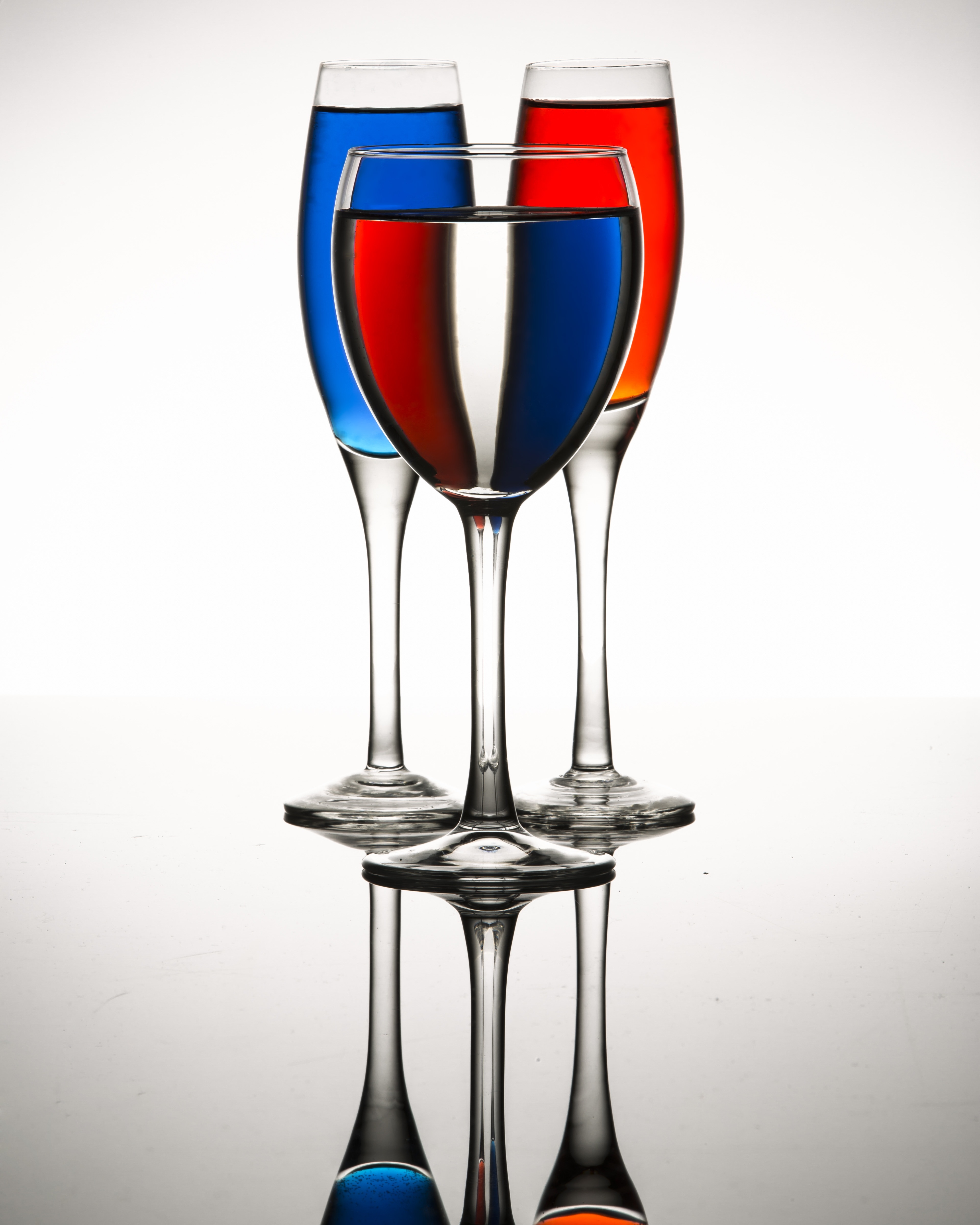 three long stem wine glasses