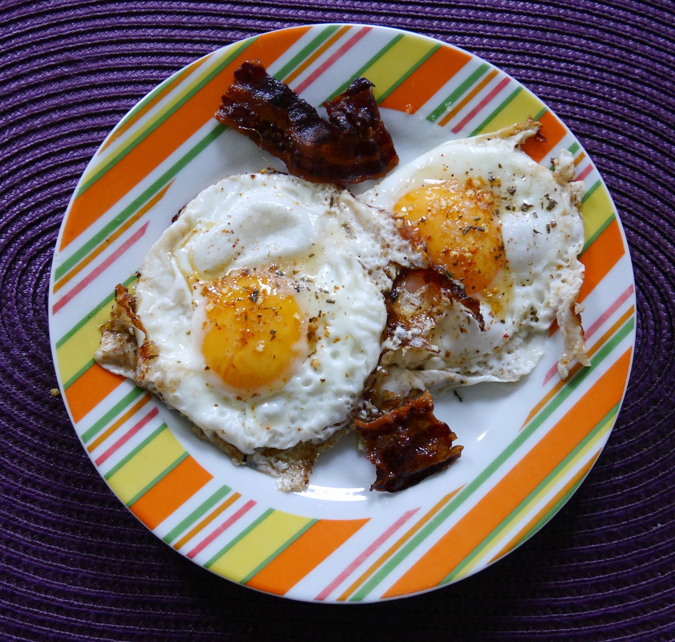 sunny sideup egg and fried bacon