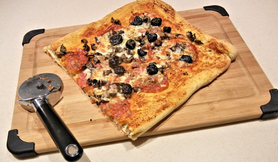 pizza, slicer and chopping board preview