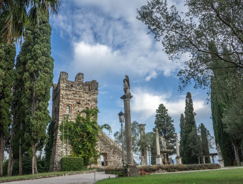 grey concrete castle near trees under cumulus cloud preview