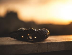 too close photography of binoculars on concrete surface thumbnail