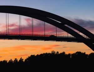 silhouette of bridge during golden time thumbnail