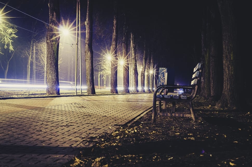 an empty road during night time preview