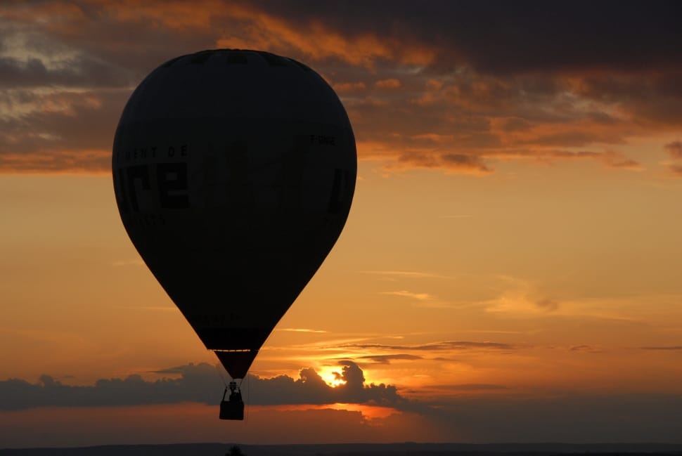 silhouette of hot air balloon during sunset preview