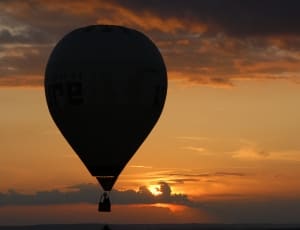 silhouette of hot air balloon during sunset thumbnail
