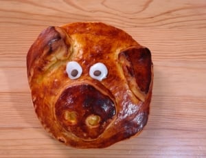 pig bread on brown wooden surface thumbnail