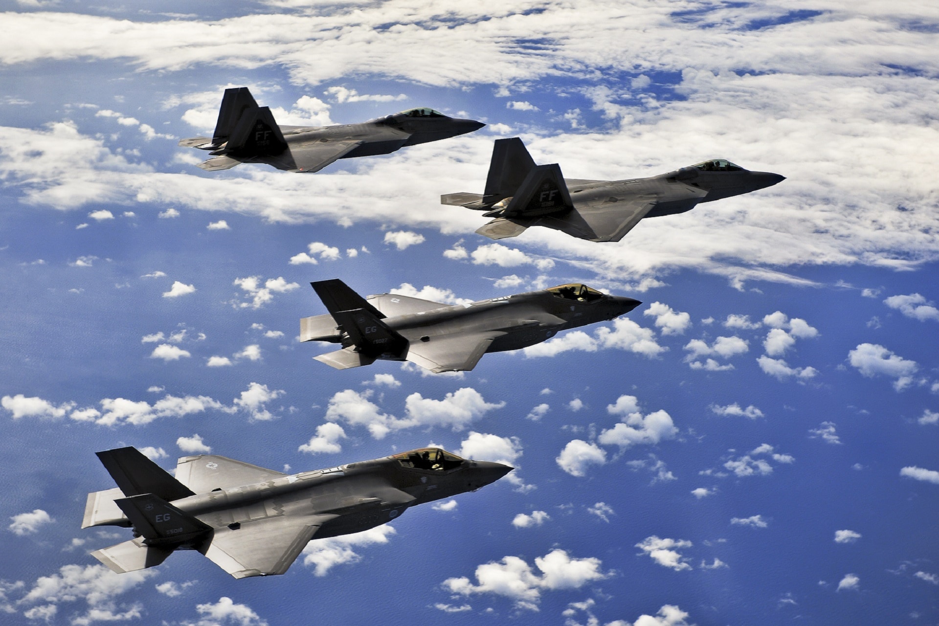 four gray fighter jets flight