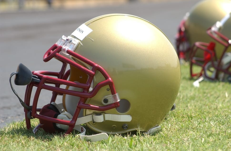 brass and red football helmet preview