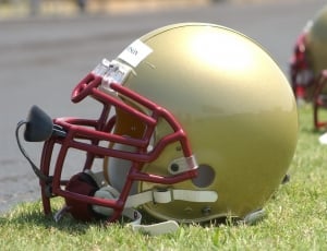 brass and red football helmet thumbnail